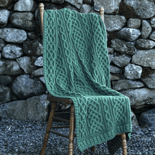 Load image into Gallery viewer, Plaited Merino Wool Aran Throw Green Color Lifestyle Tara
